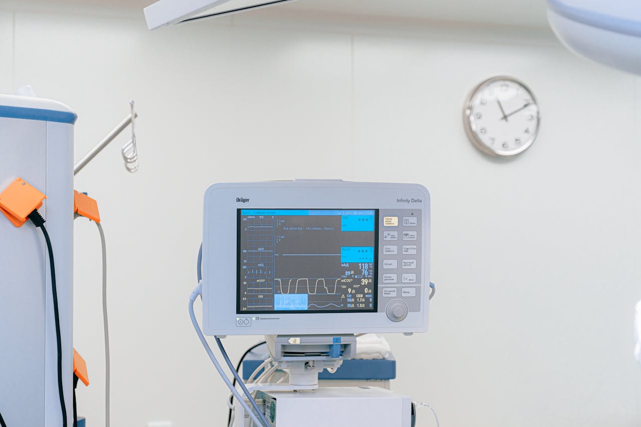 about-img A modern heart rate monitor in a sterile hospital setting, showcasing medical technology.